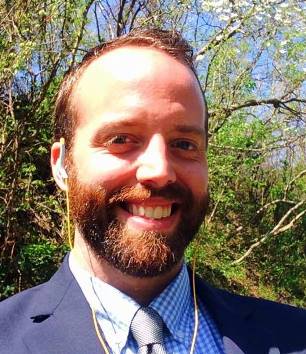 A man smiling at the camera.