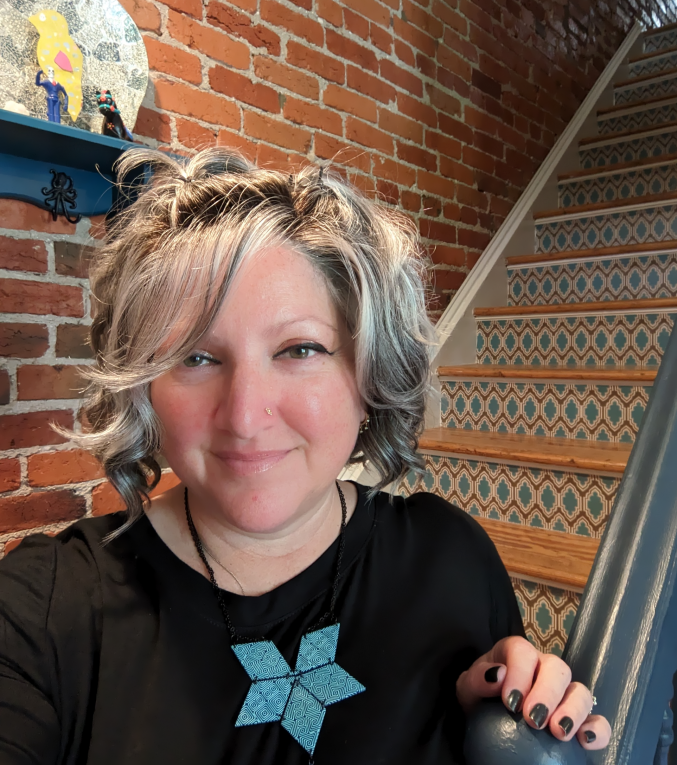 A woman with short light colored hair