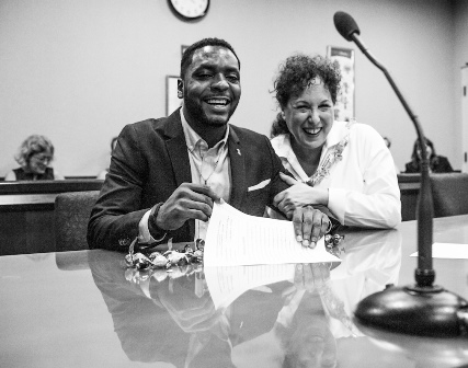 A teenager with his adoptive parent